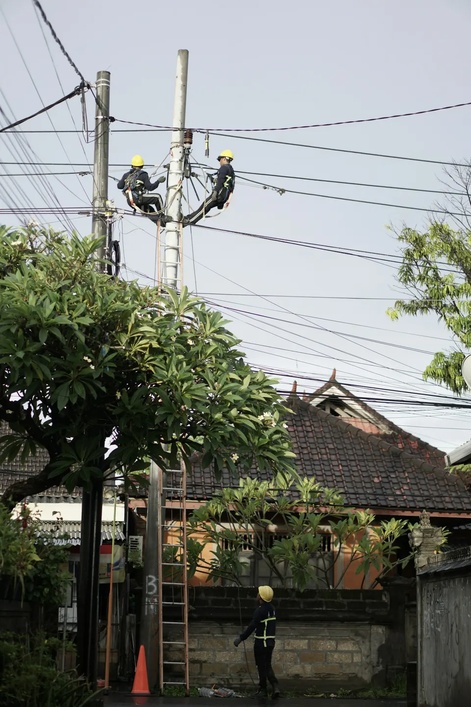Utility worker maintaining power infrastructure outdoors